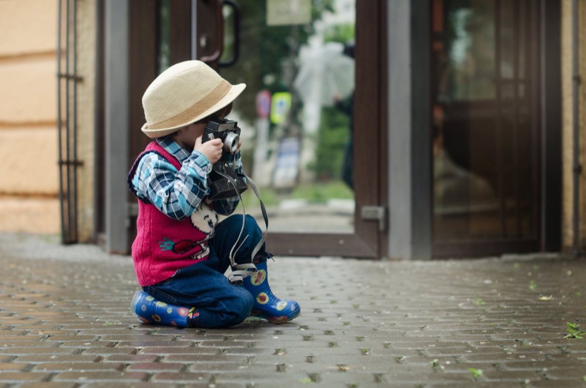 Child holding a camera